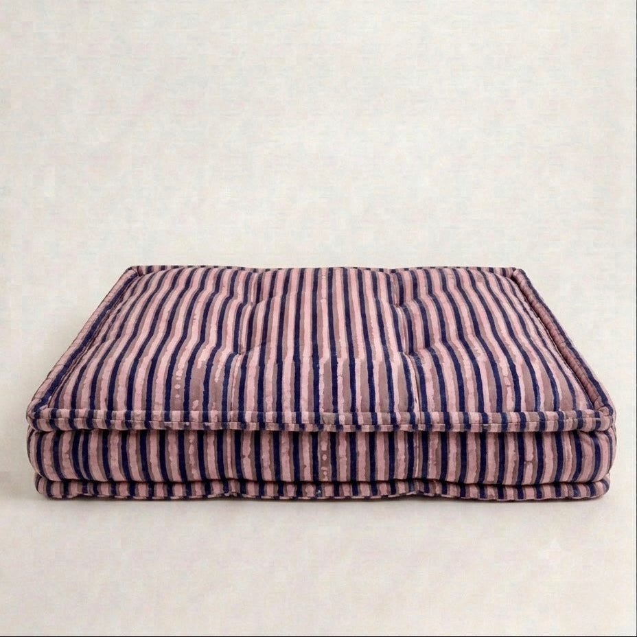 Striped pet bed on a white background