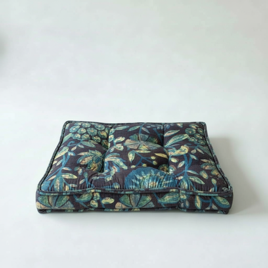 Floral-patterned pet bed on a white background