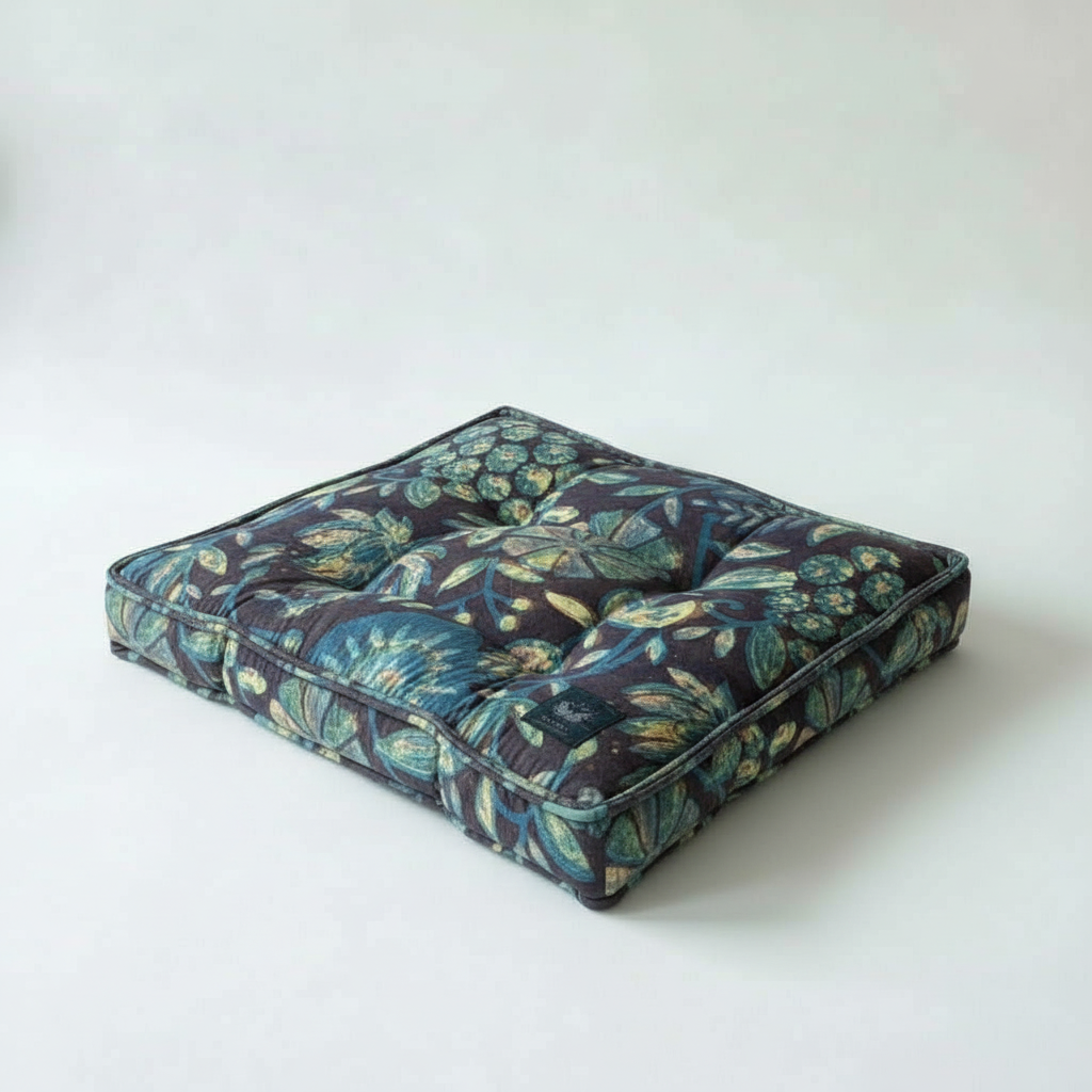 Floral-patterned dog bed on a white background