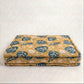 Floral-patterned blanket on a white background