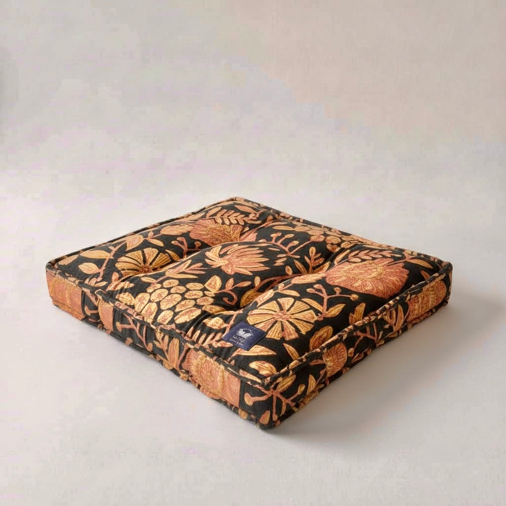 Floral patterned pet bed on a light gray background