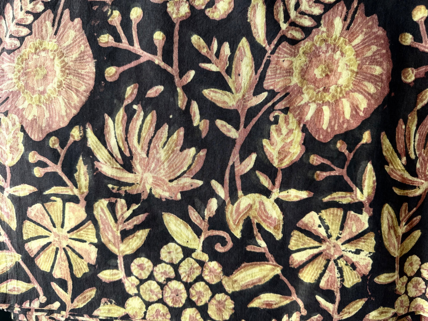 Floral pattern with pink and green flowers on a brown background