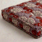 Floral-patterned fabric folded on a light background