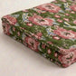 floral withgreen background cushion corner on a white surface