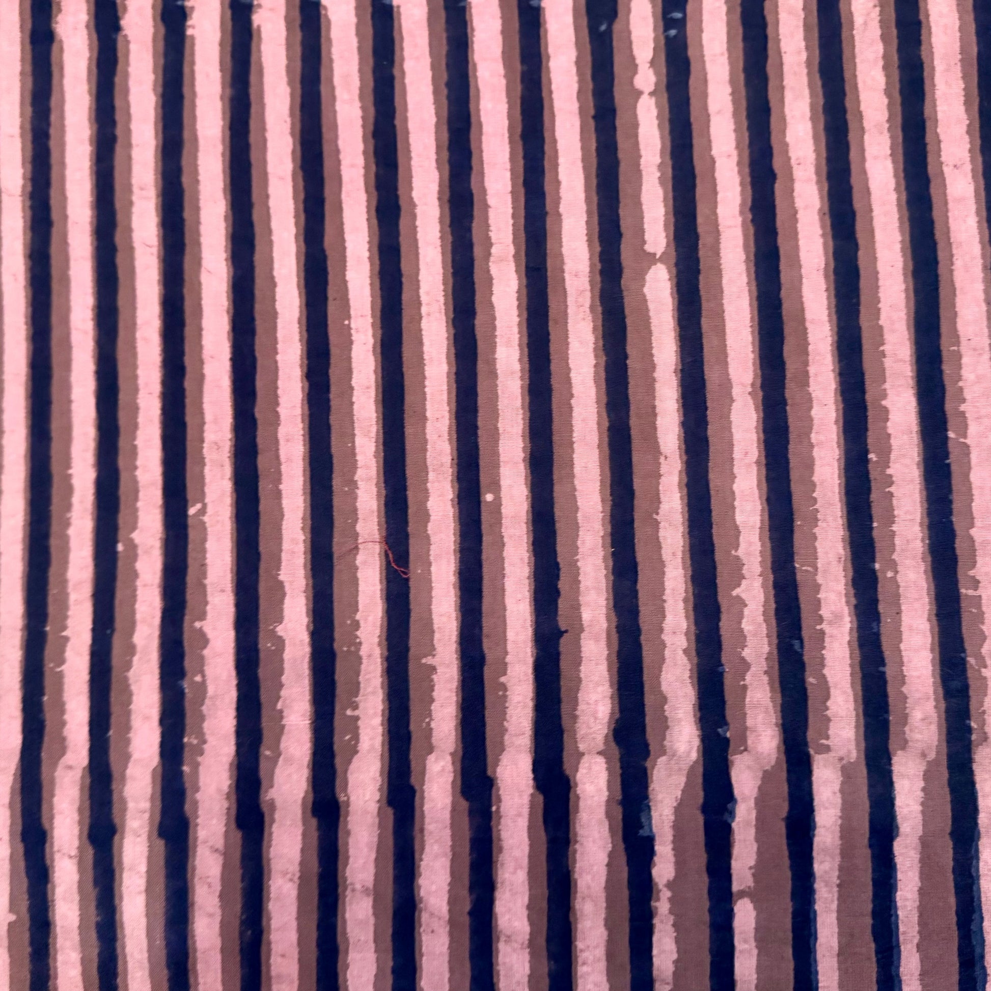 Textured fabric with vertical stripes in lavender and pink 