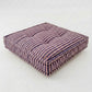 Striped cushion on a white background