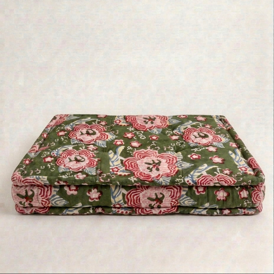 Floral patterned pet bed on a white background