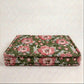 Floral patterned pet bed on a white background