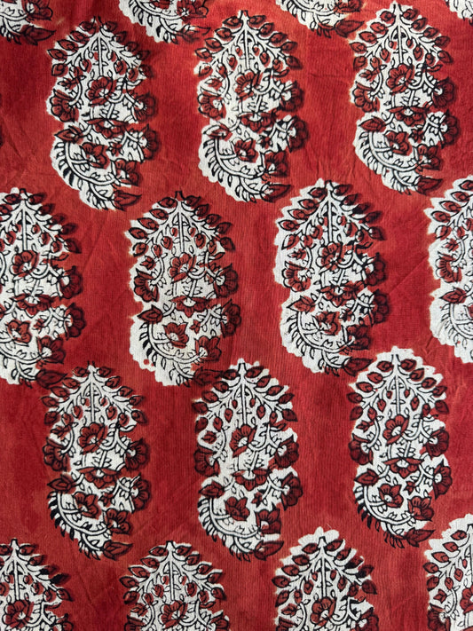 Red fabric with white and maroon paisley pattern