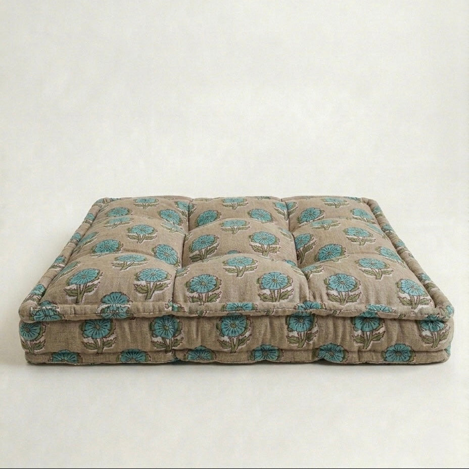 Floral patterned pet bed on a white background