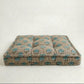 Floral patterned pet bed on a white background
